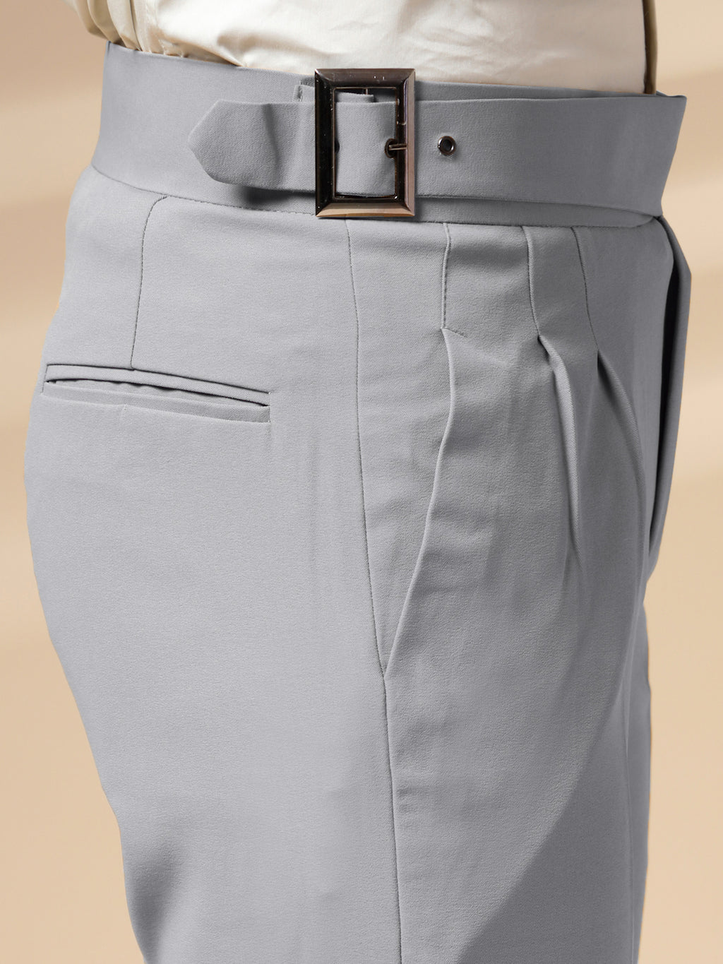 Gray Gurkha Pant with a belt on a beige background